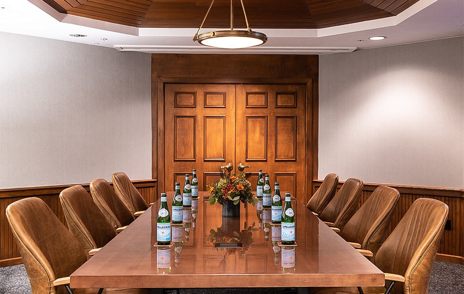 a meeting venue with a long wooden table