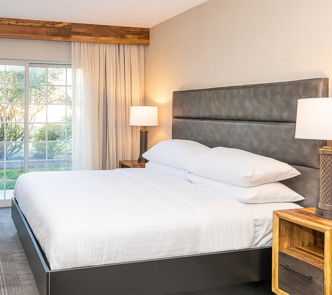 a bed with a large headboard