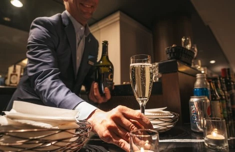 a man holding a glass of champagne