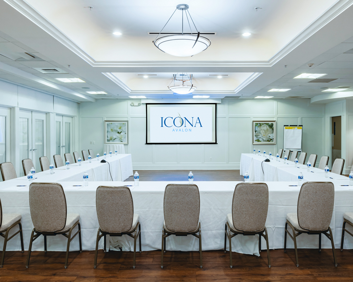 a room with a large table and chairs
