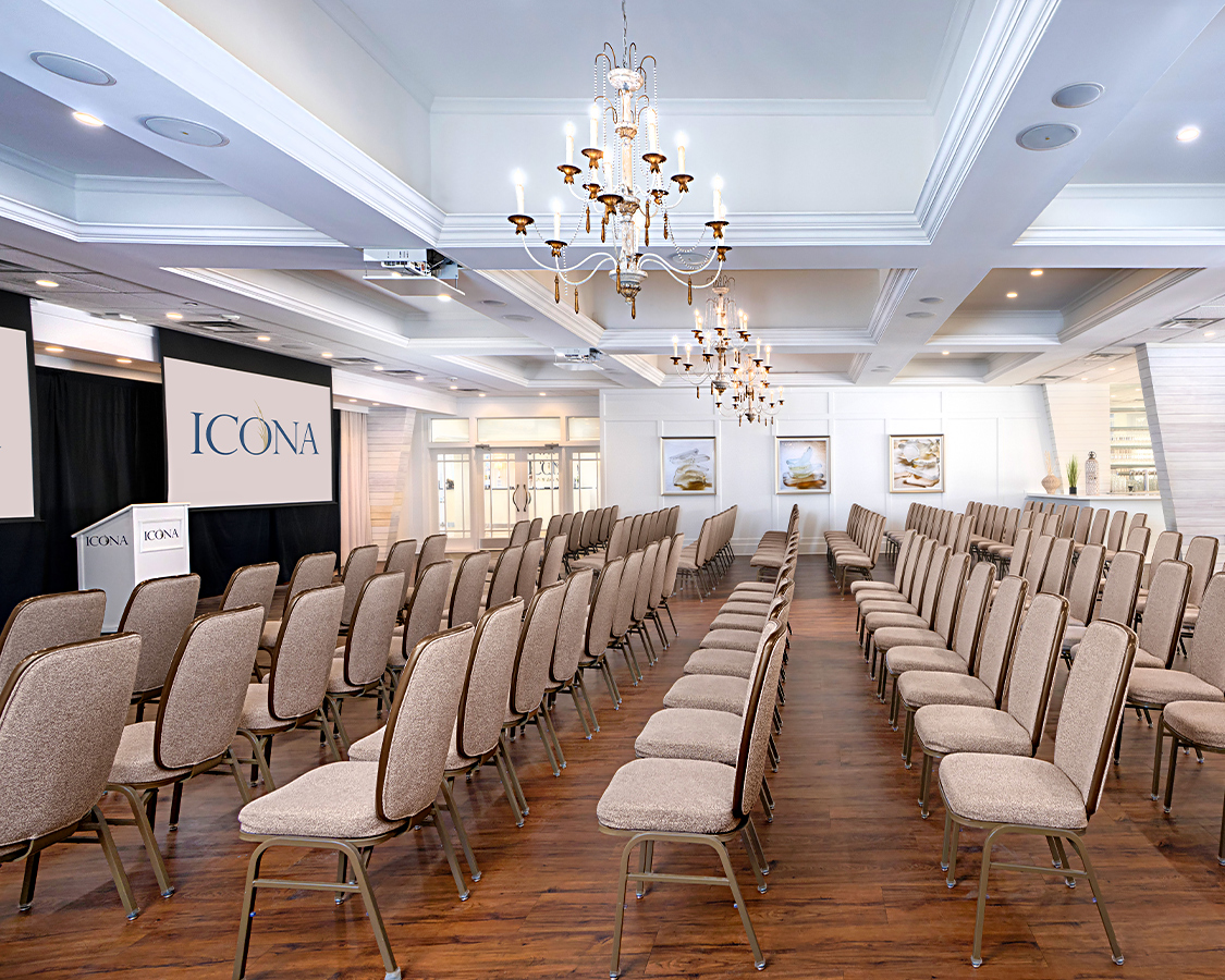 a room with many chairs and chandeliers