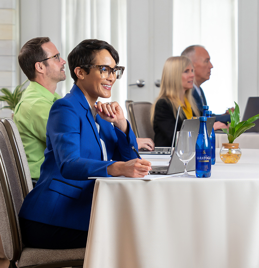 a group of people sitting at a table