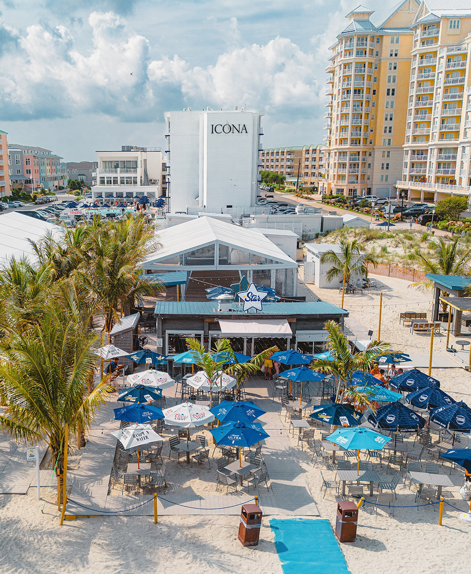 a building with umbrellas and tables and chairs