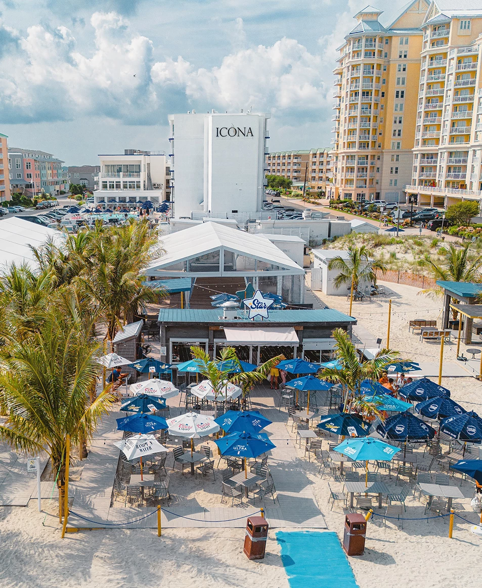 a building with umbrellas and tables and chairs