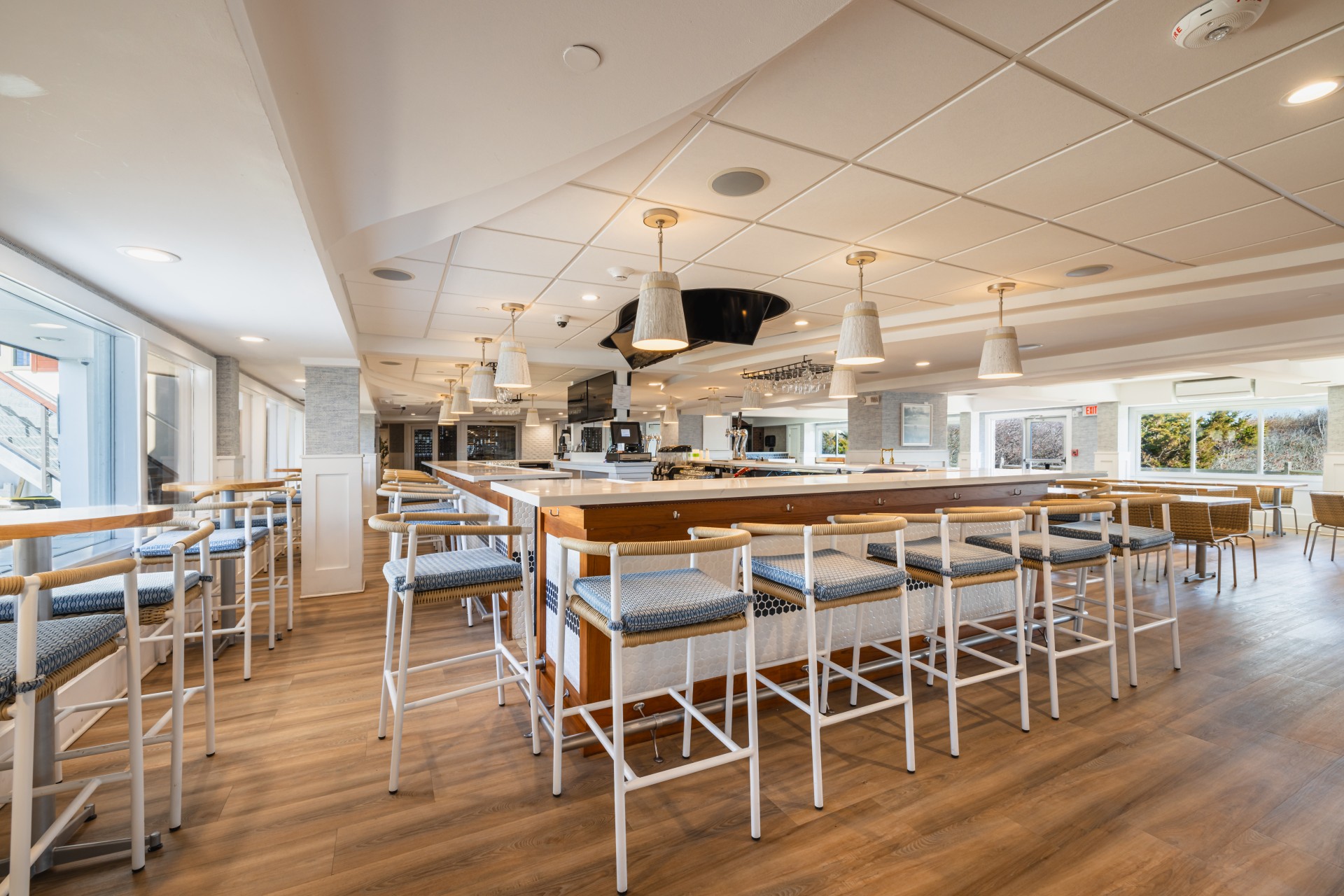 a room with a bar and chairs
