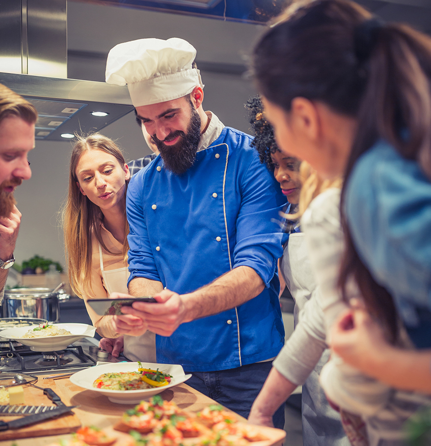 a group of people in a kitchen