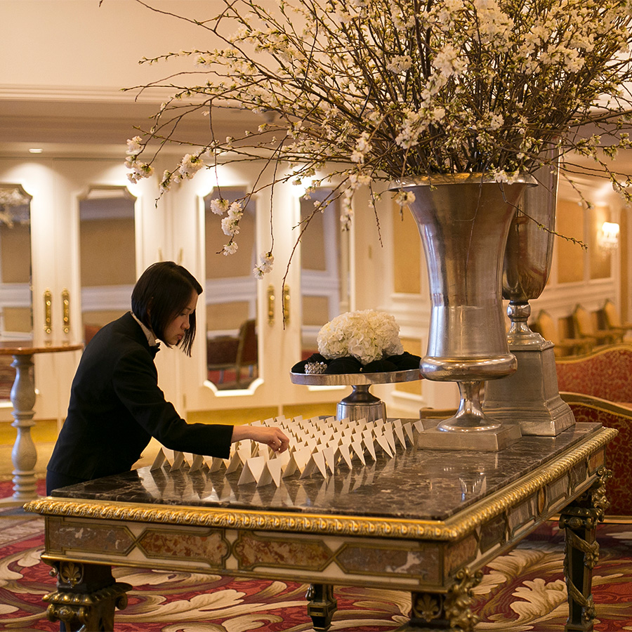 a woman playing chess in a room