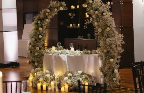a table with flowers and candles