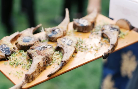 a plate of meat on a wooden board