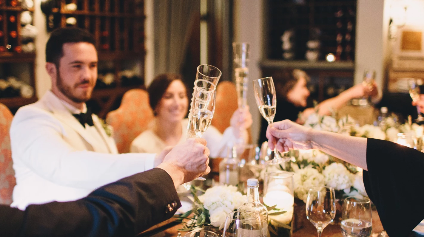 a group of people holding champagne glasses