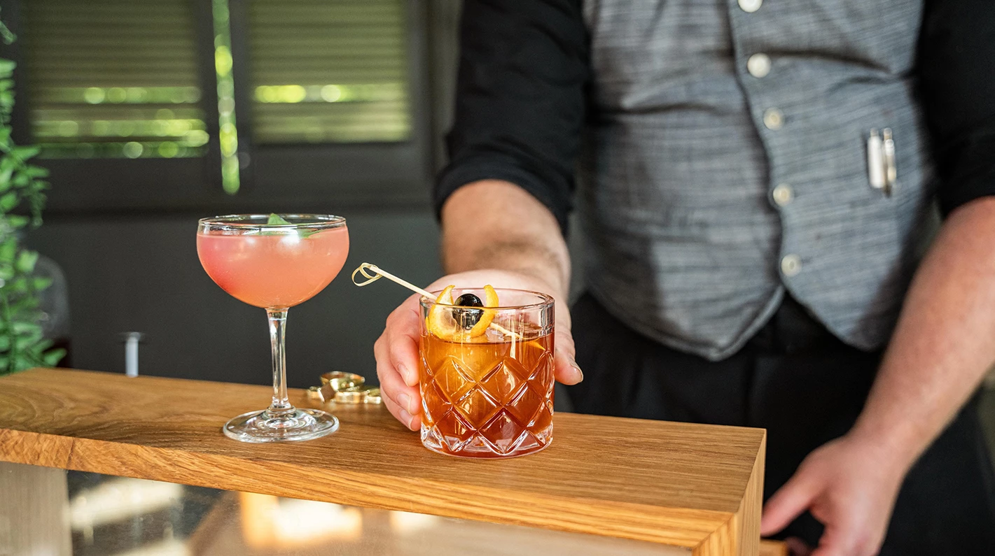 a person holding a drink