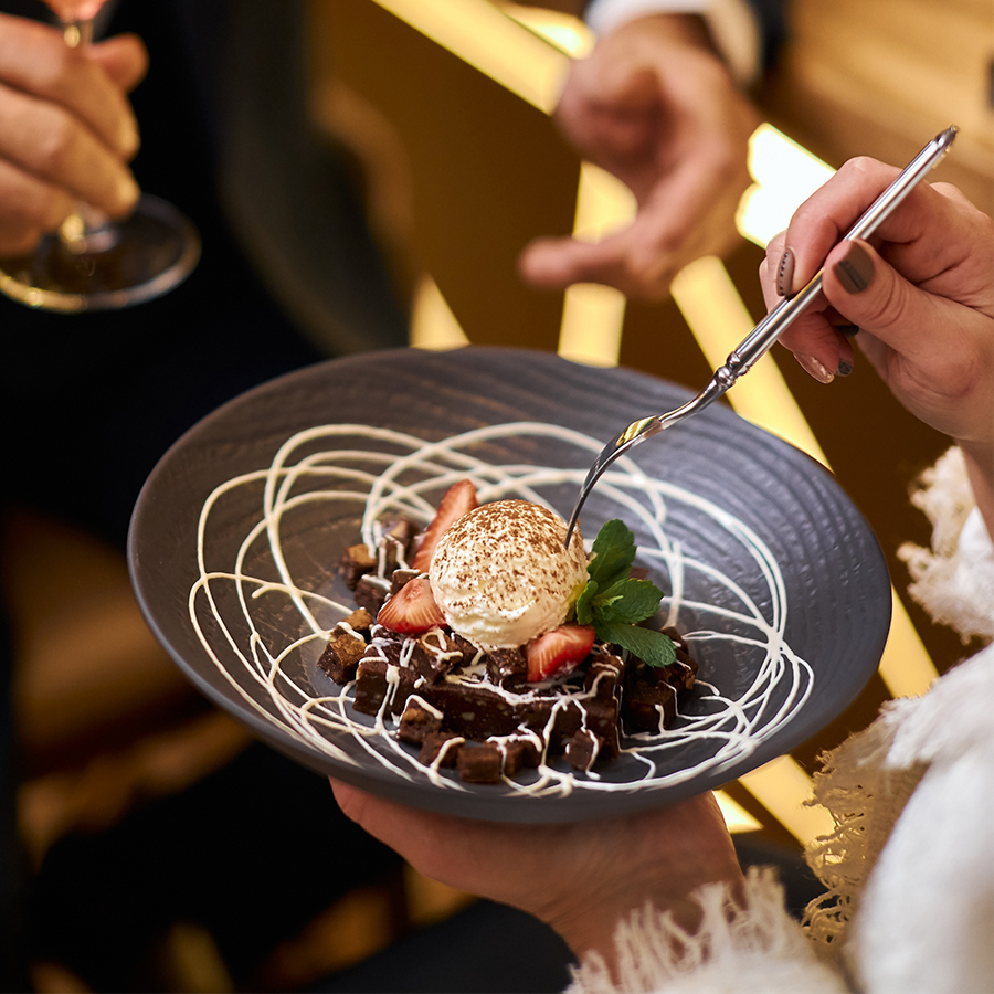 a person holding a plate of food