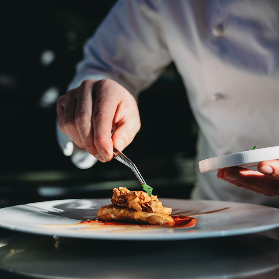 a person holding a plate of food
