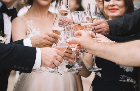 a group of people holding wine glasses