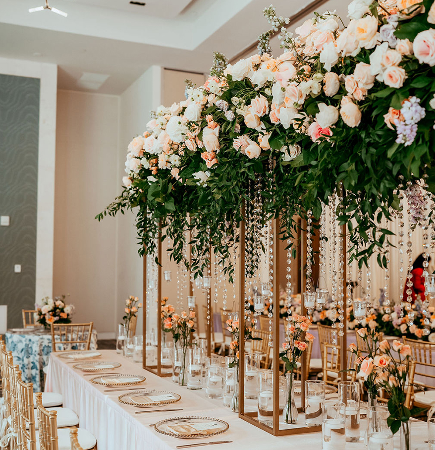 a table with flowers and candles