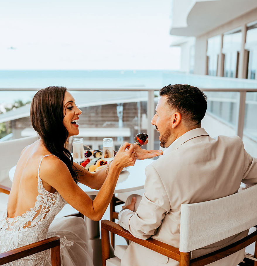 a woman feeding a man