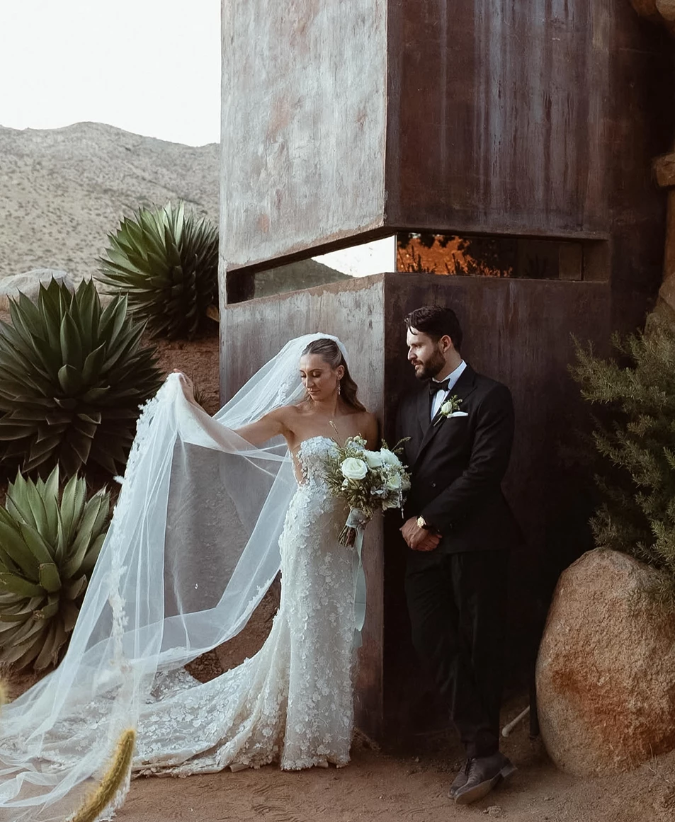 a man and woman in wedding attire