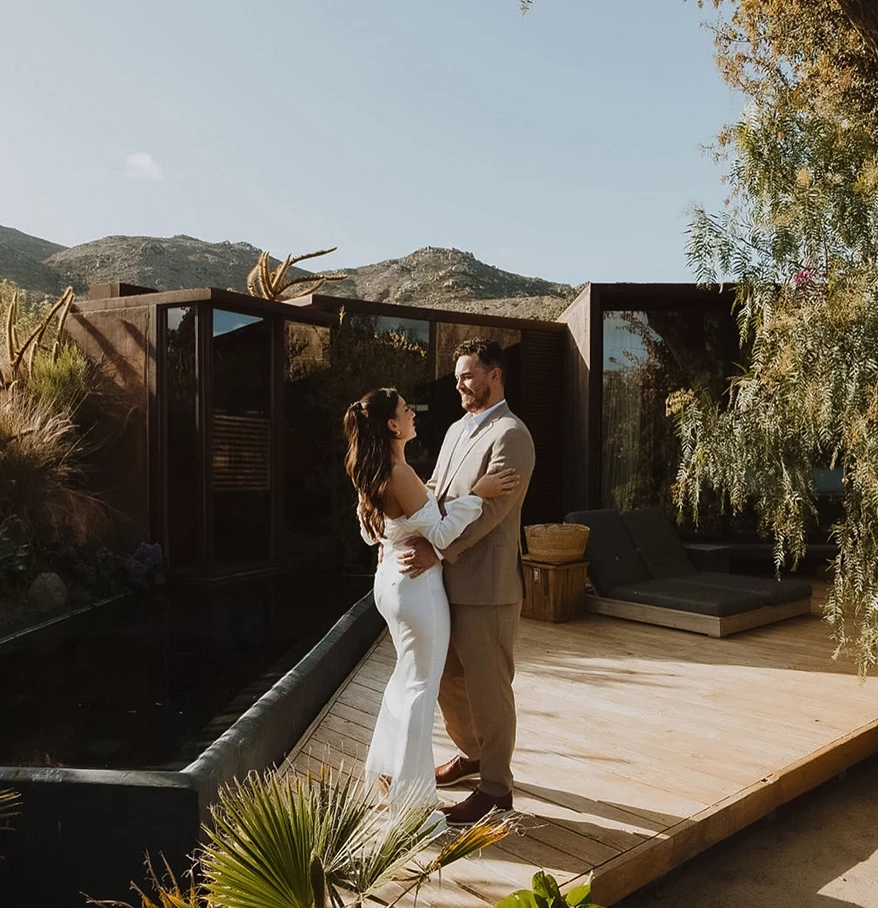 a man and woman standing on a deck