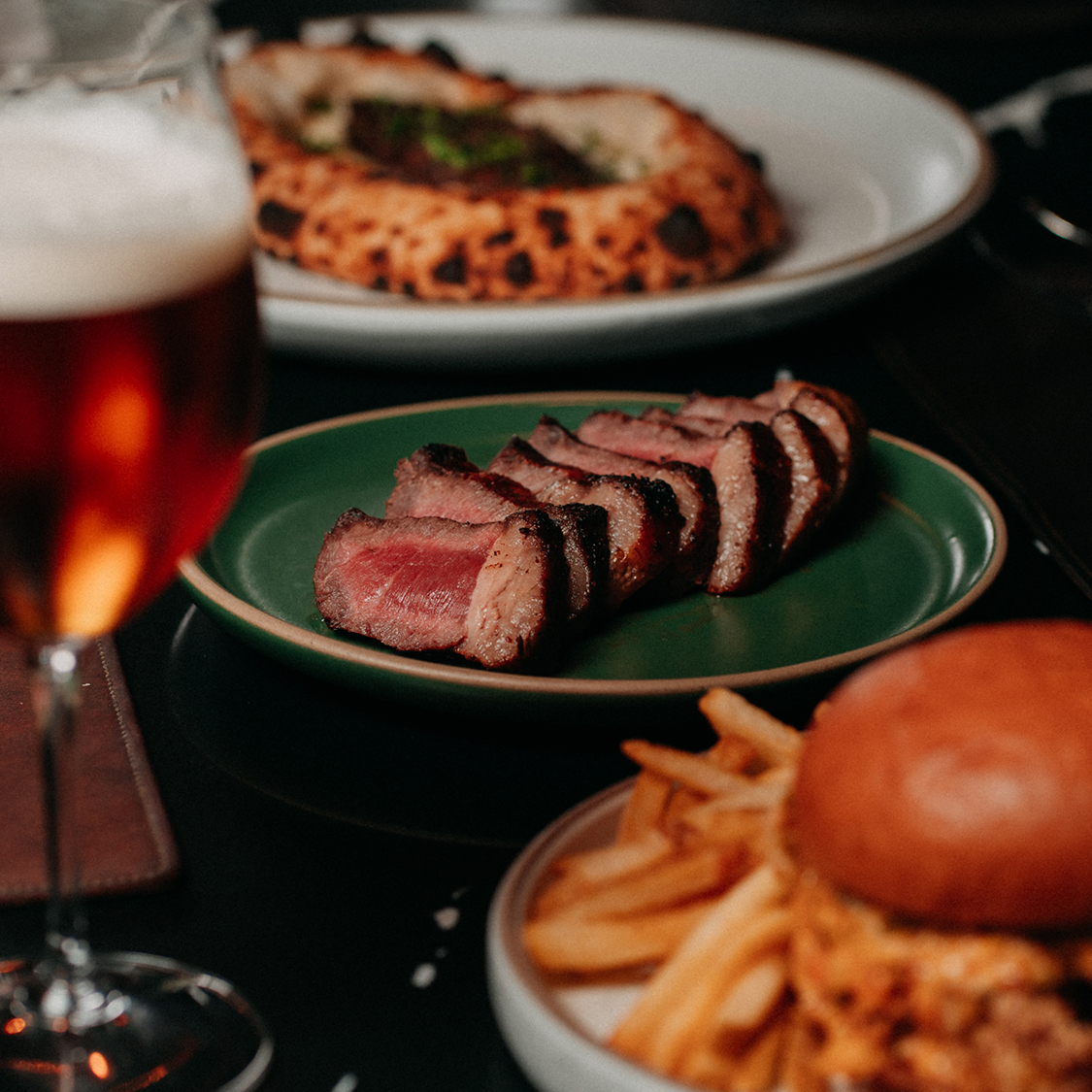 a plate of meat and fries on a table
