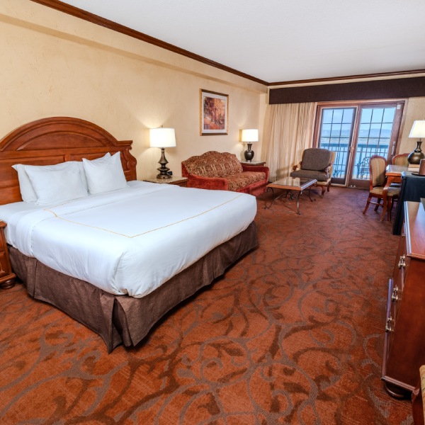 a hotel room with a bed and a couch