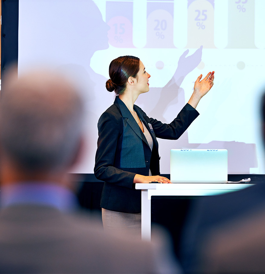 a woman standing in front of a screen
