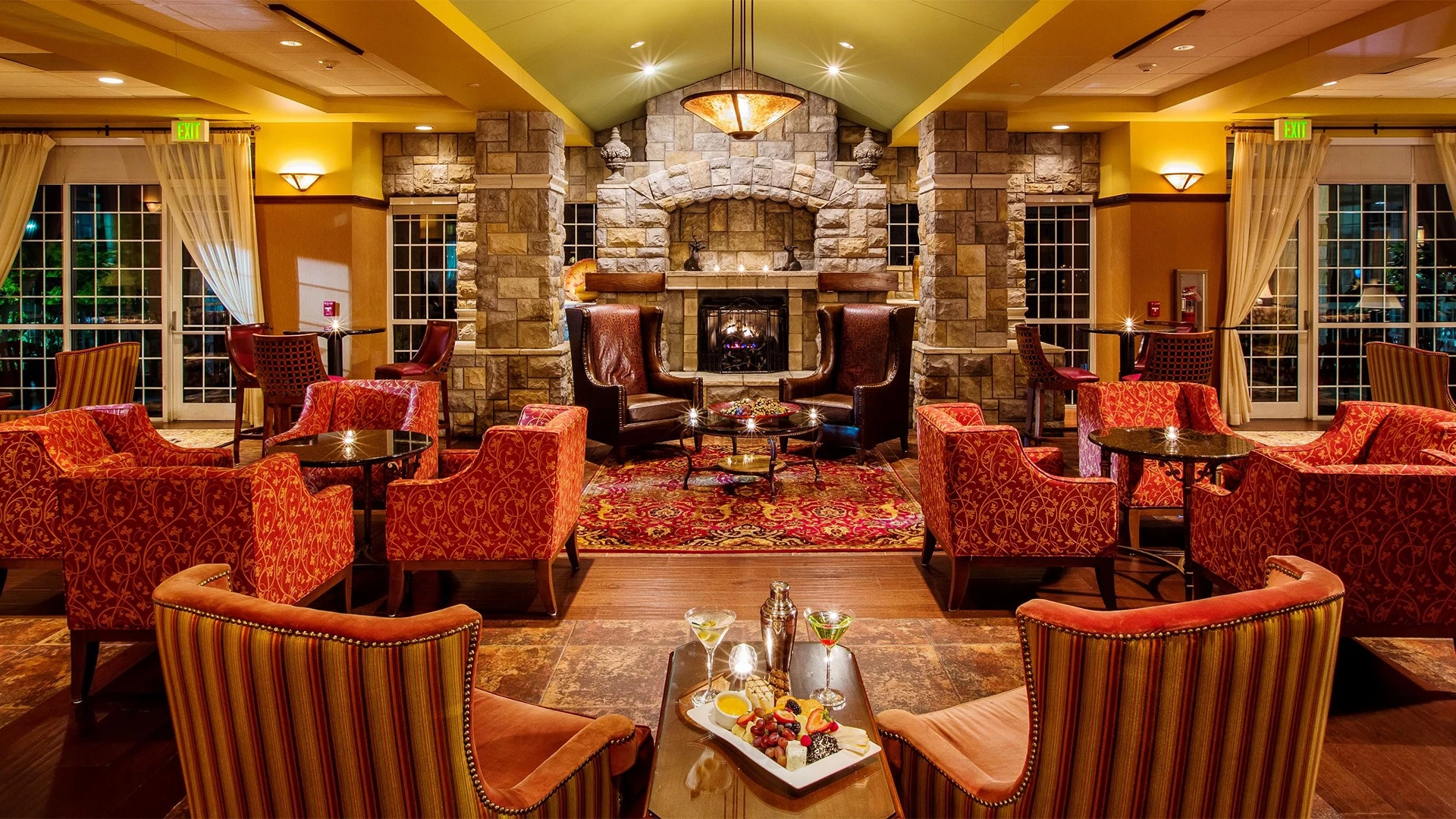 a room with chairs and a fireplace