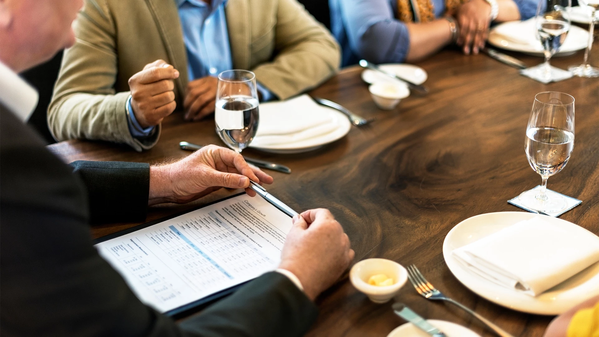 a group of people sitting at a table