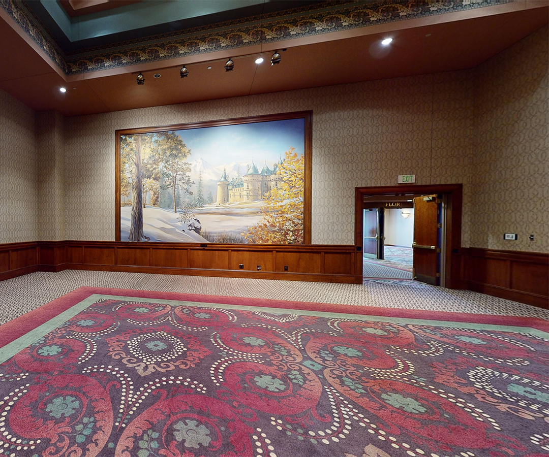 a large painting on the wall of a room