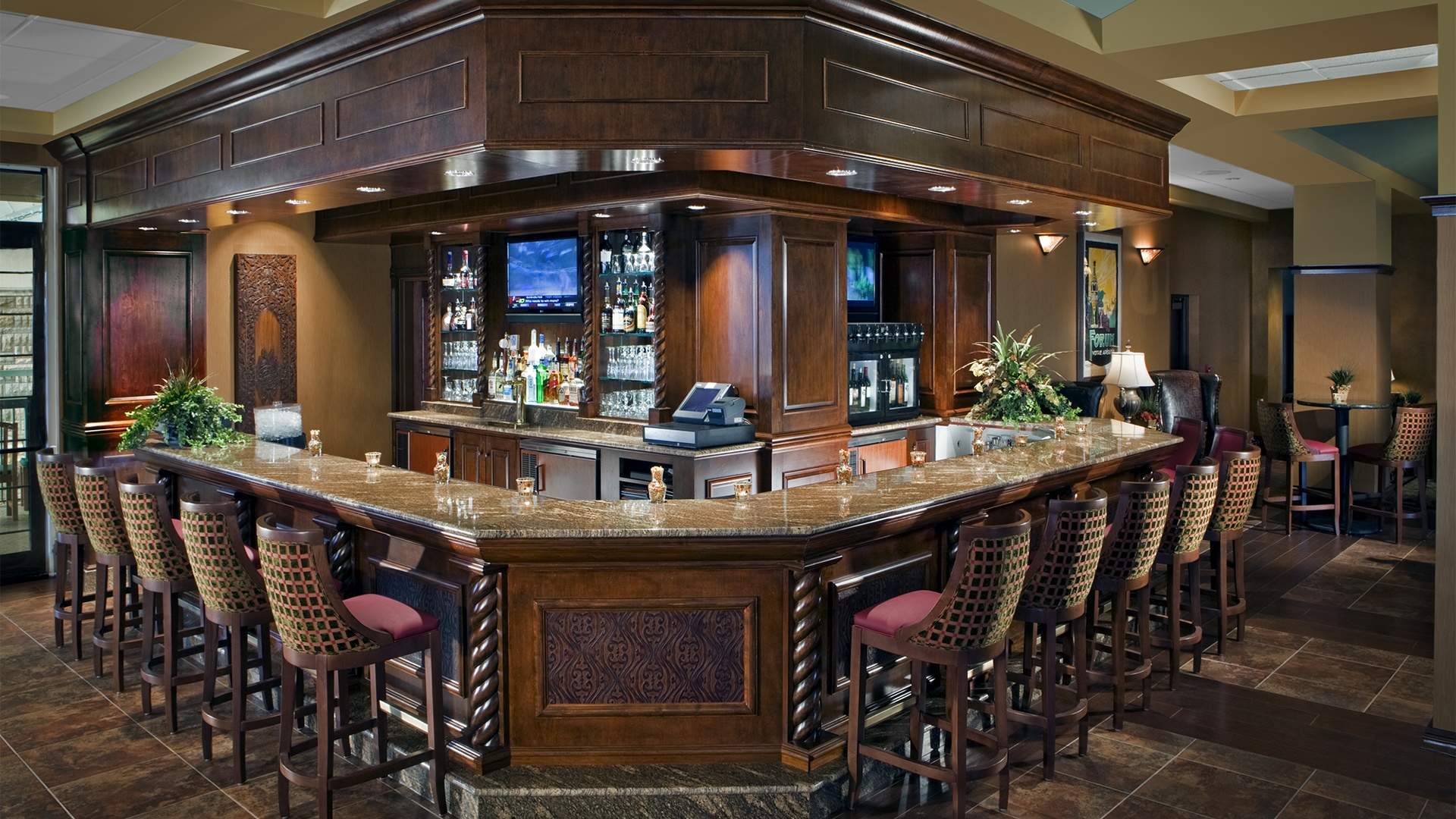 a bar with a counter and bar stools