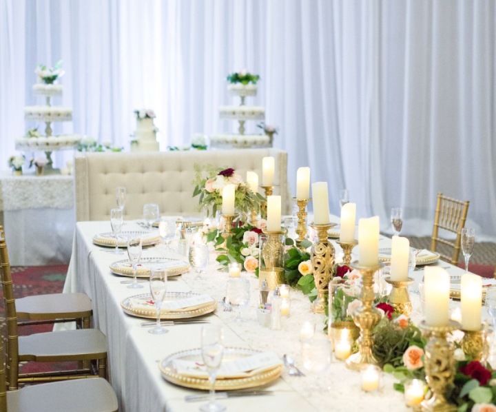 a table with candles and flowers