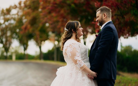 a man and woman holding hands