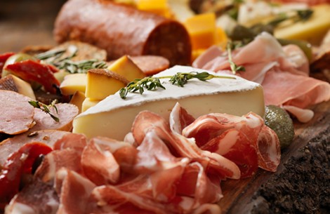 charcuterie board with meats and cheeses
