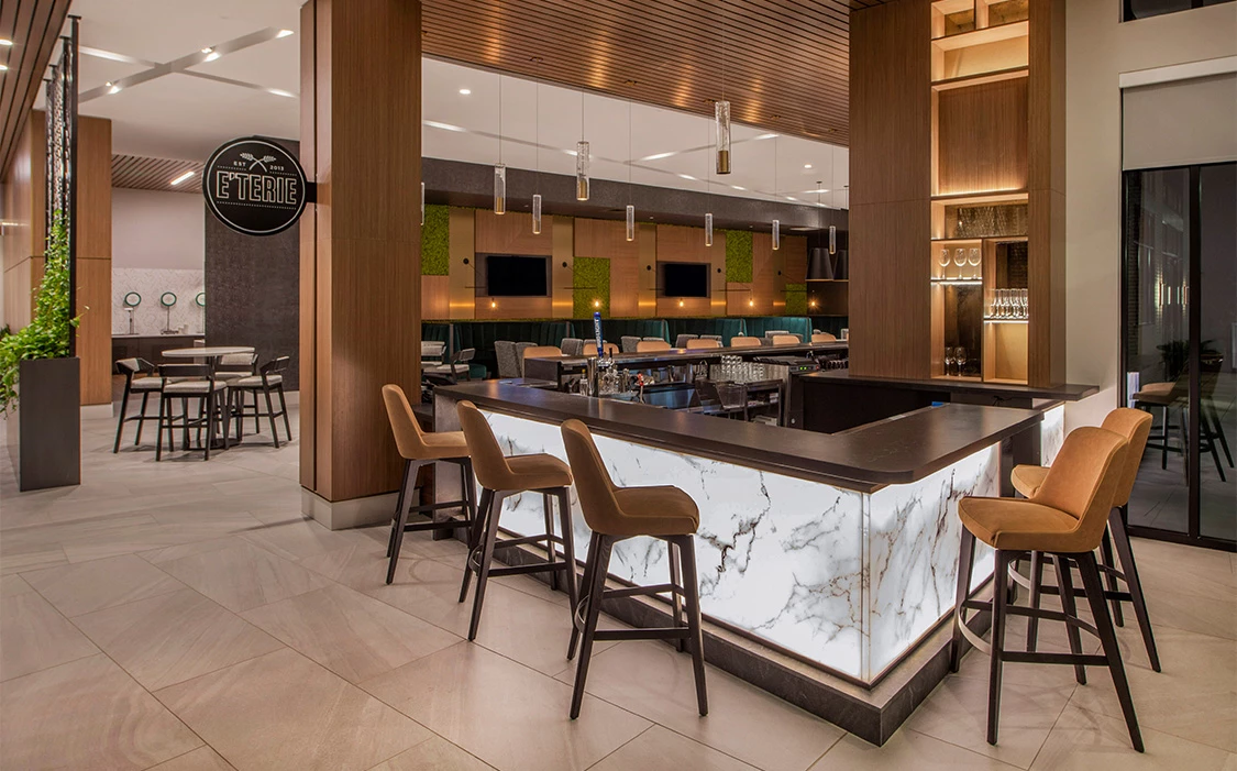 a bar with chairs and a counter