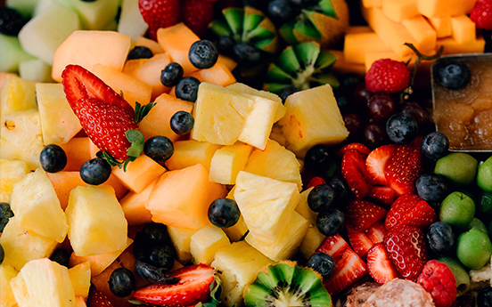 a bowl of fruit and berries