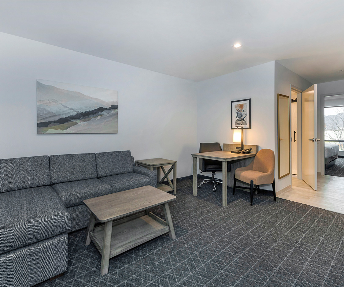 a room with a couch and a desk