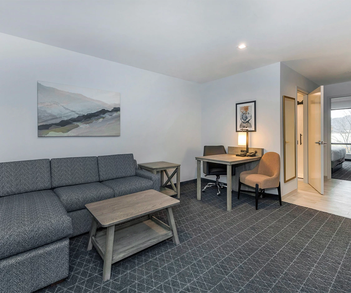a room with a couch and a desk