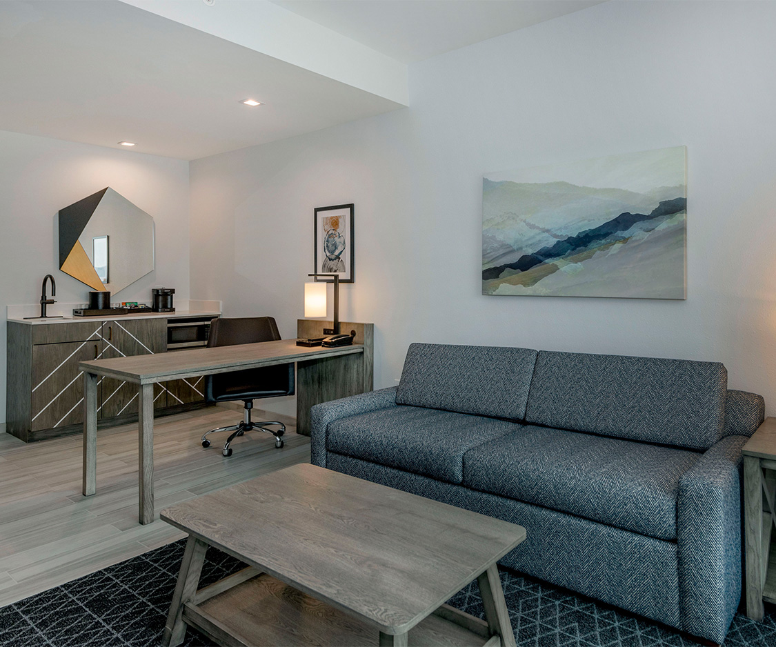 a room with a couch and a desk