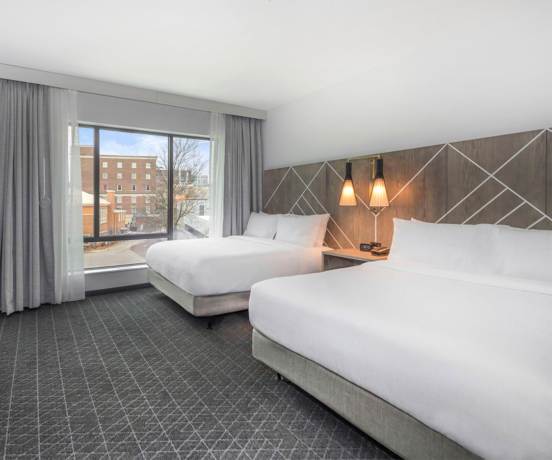 a hotel room with two beds