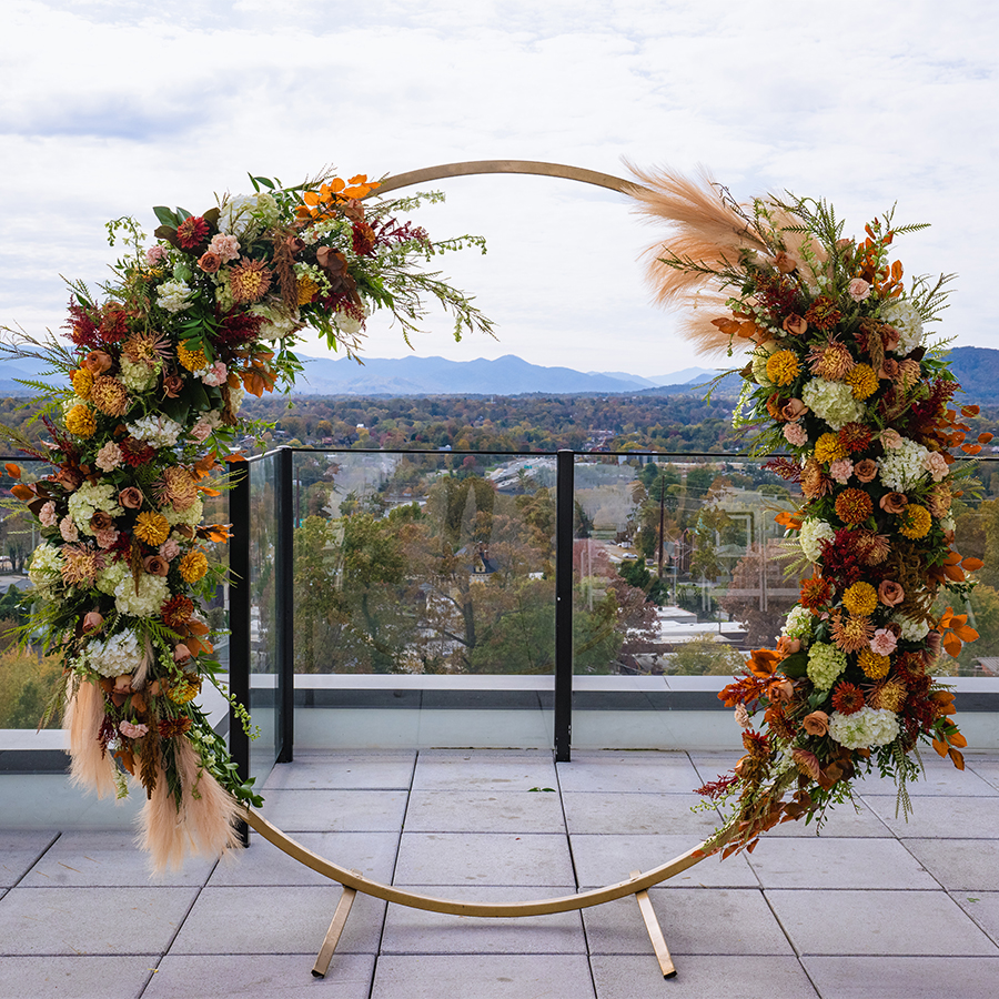 a circular floral arch on a balcony