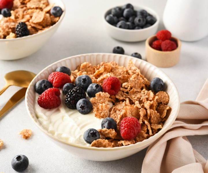 a bowl of cereal with berries and yogurt