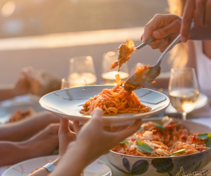 a person serving food to another person