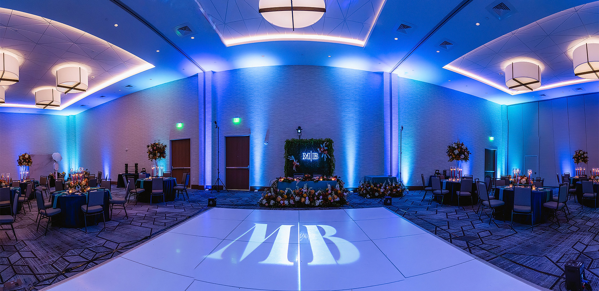a dance floor with lights and flowers