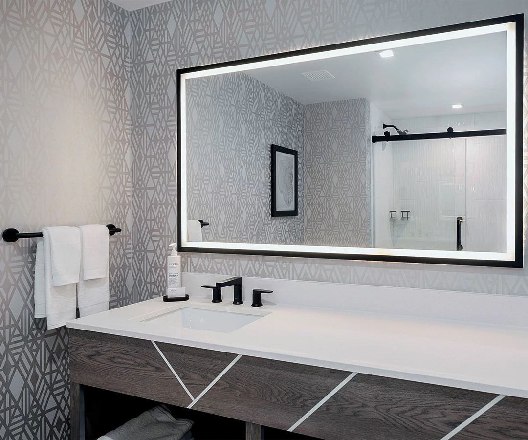 a bathroom with a large mirror
