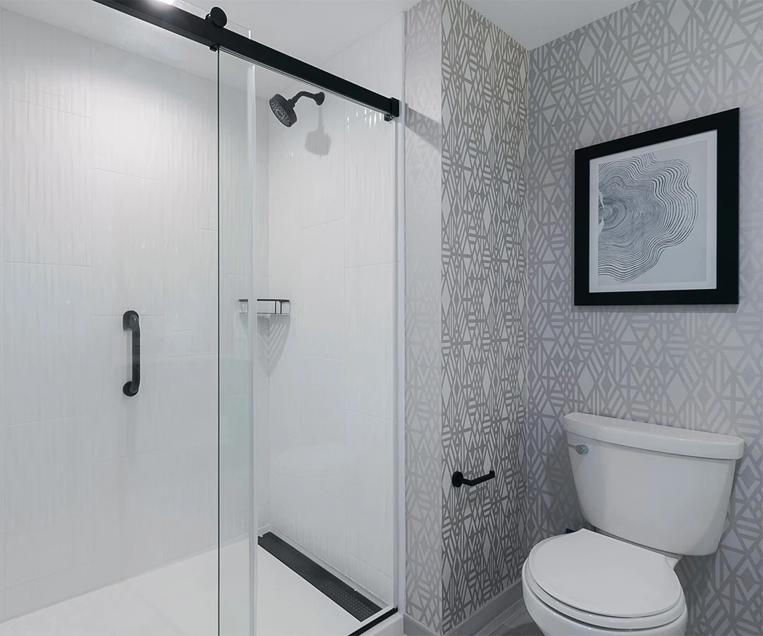 a bathroom with a toilet and shower