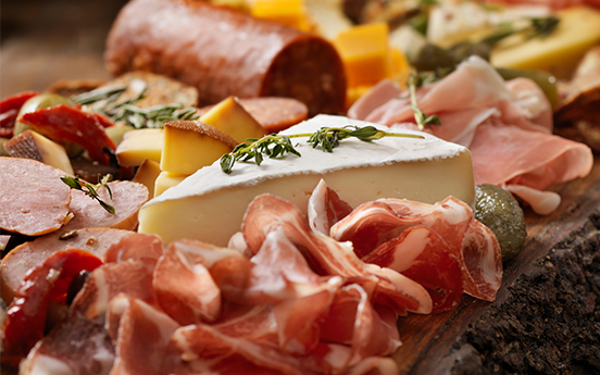 charcuterie board with meats and cheeses 