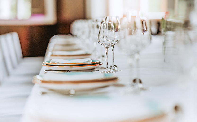 a row of wine glasses on a table