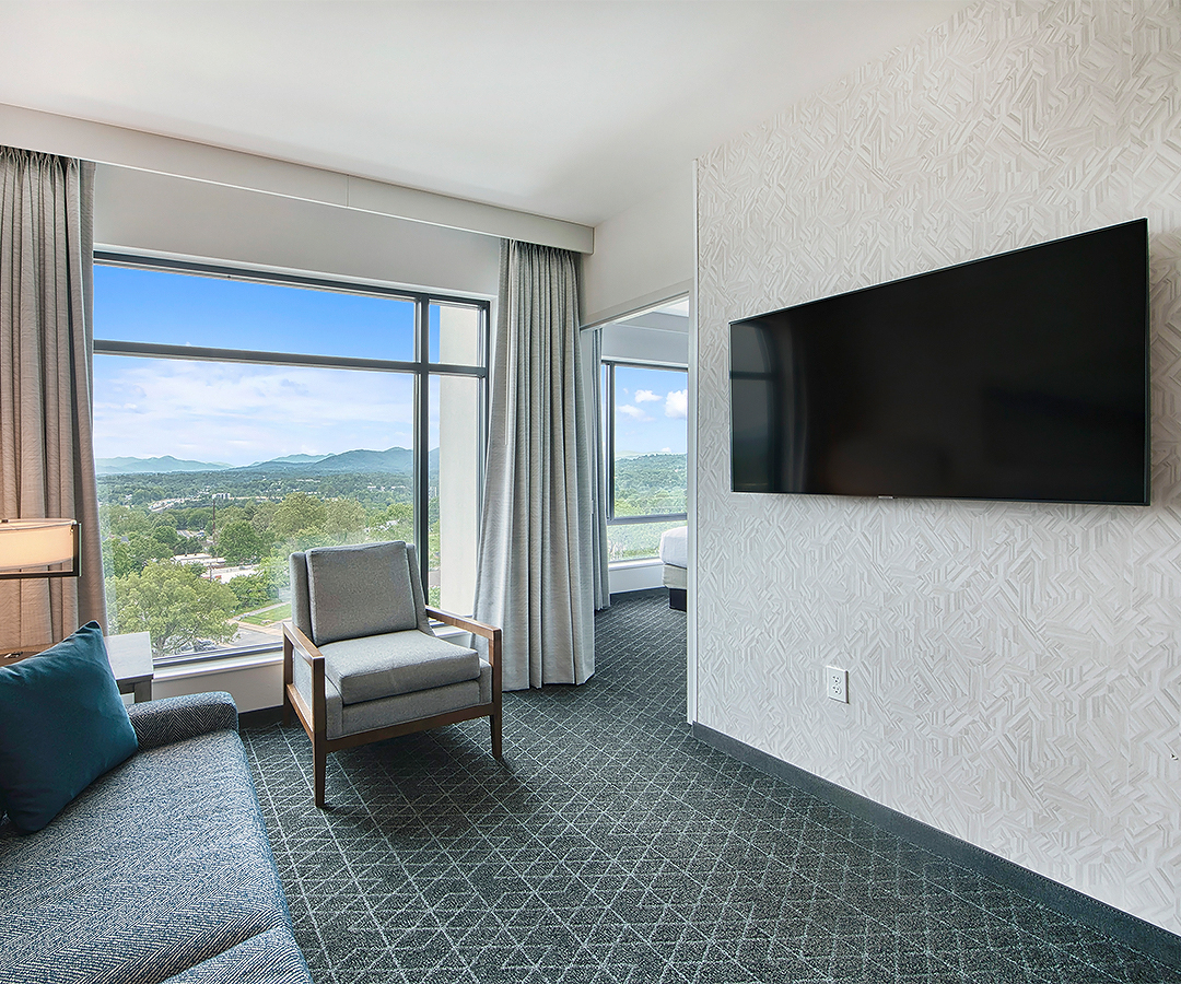 a room with a television on the wall