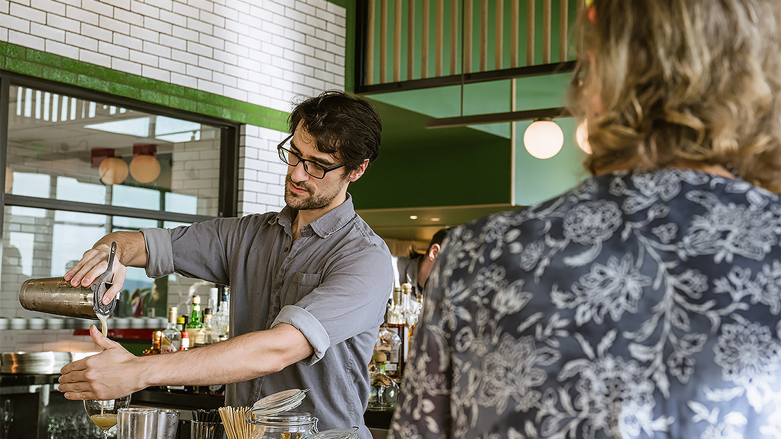 a man standing next to a woman