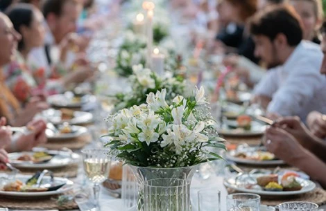a table with flowers and candles