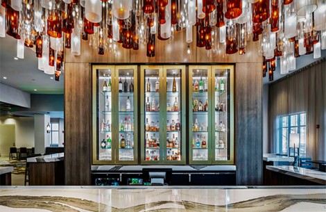 a bar with bottles and lights